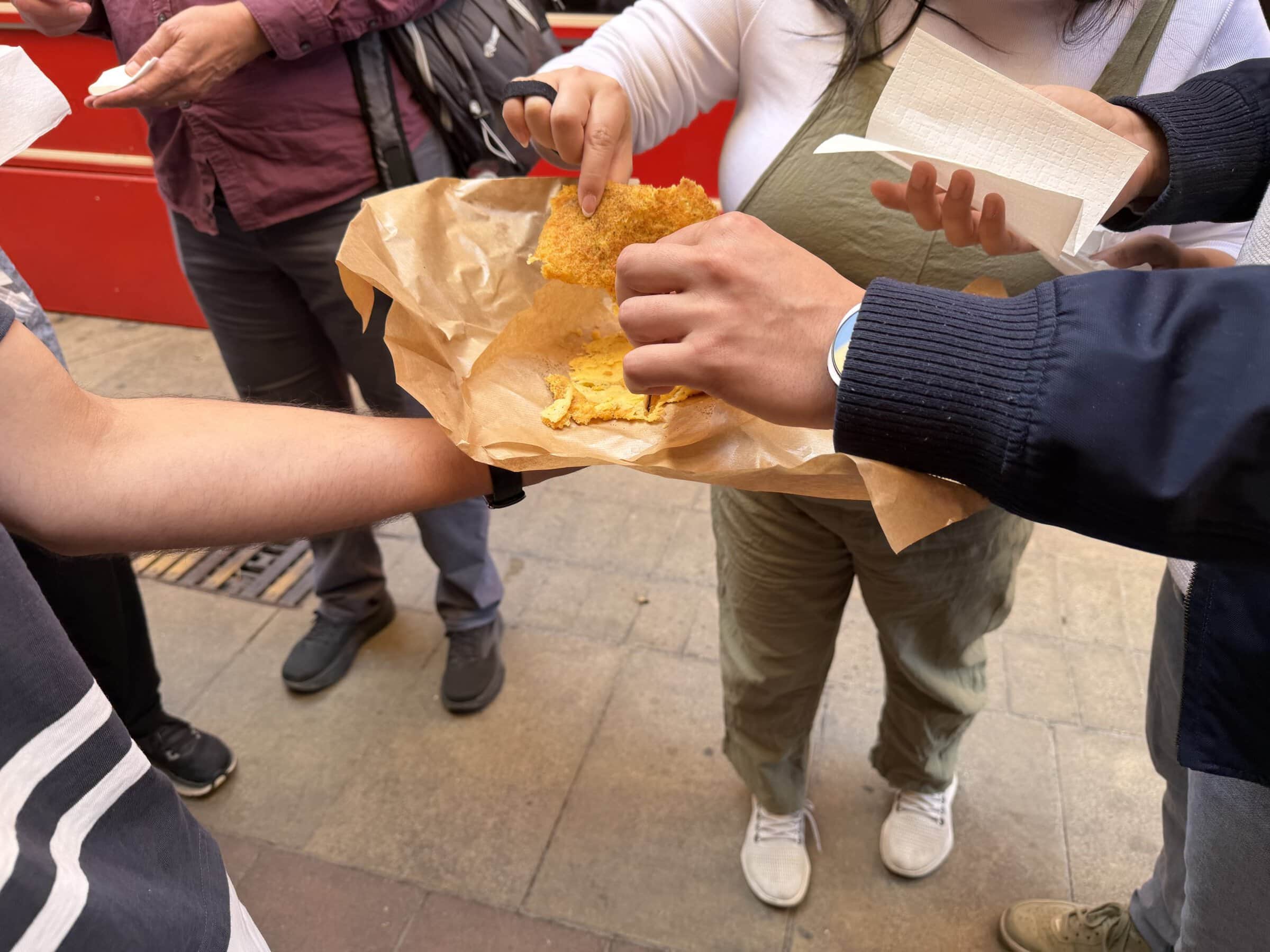 Sampling big scraps of the yummy socca chickpea flour bread.