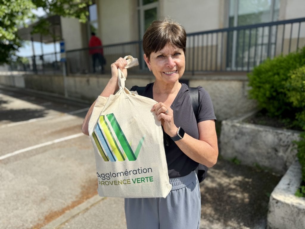 Karen showing off the bag of meds we left in Lyon
