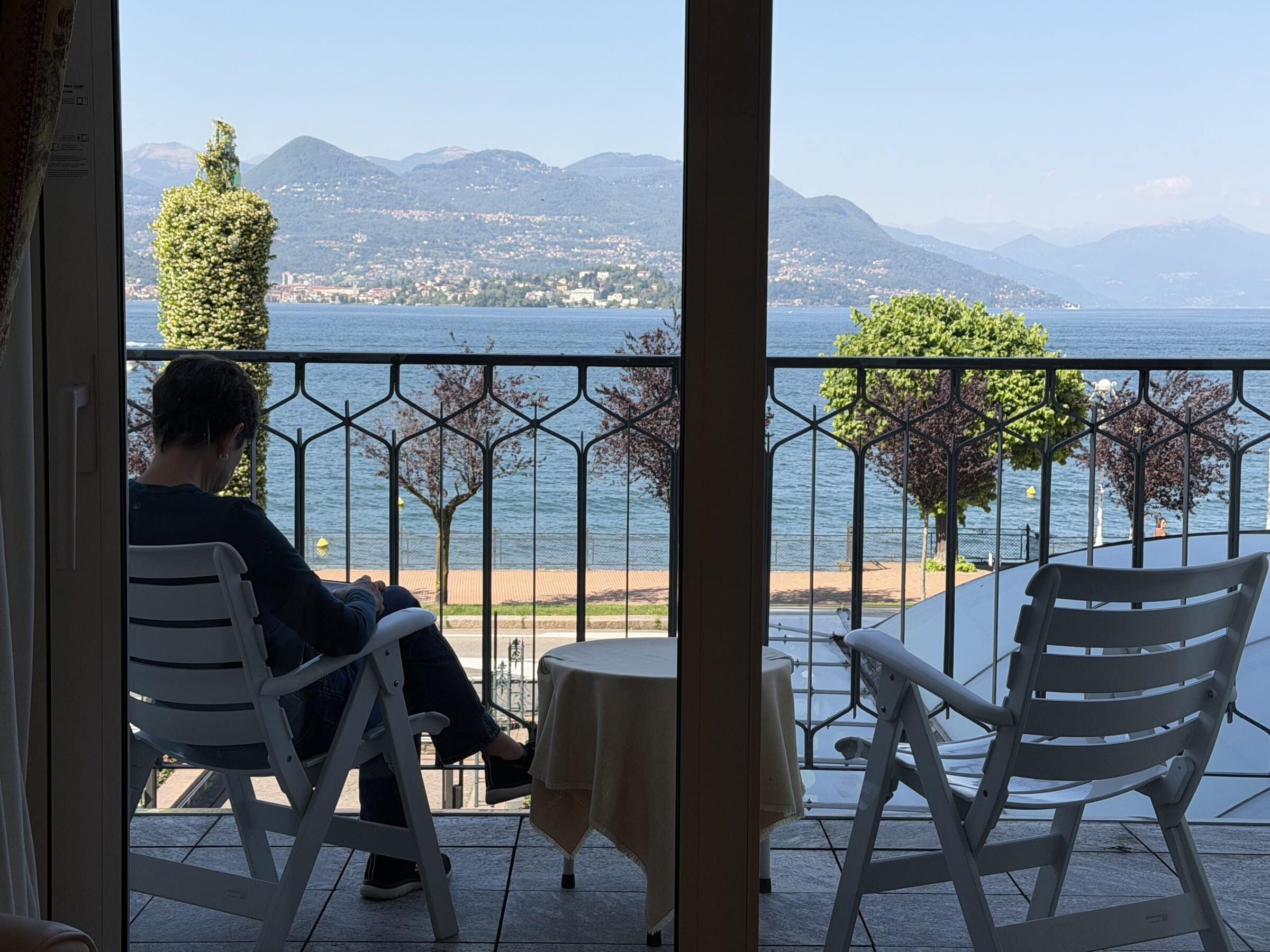 Karen out on the porch of our hotel room overlooking Lake Maggiore