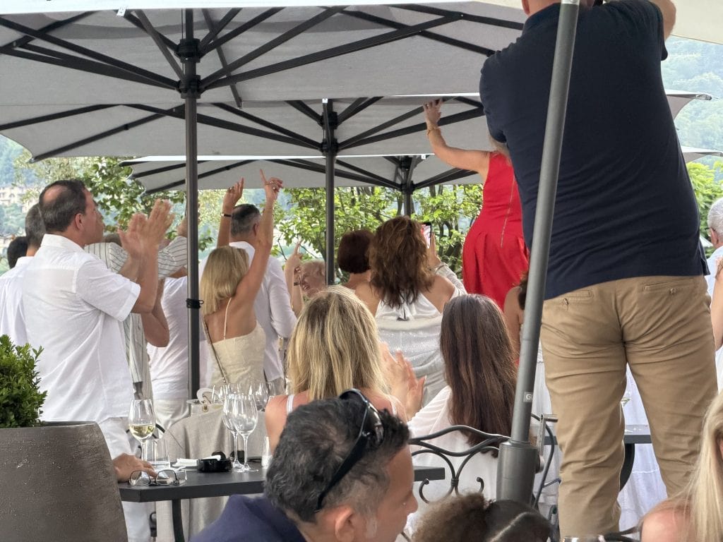 Dancing at the rehearsal dinner including the bride in red