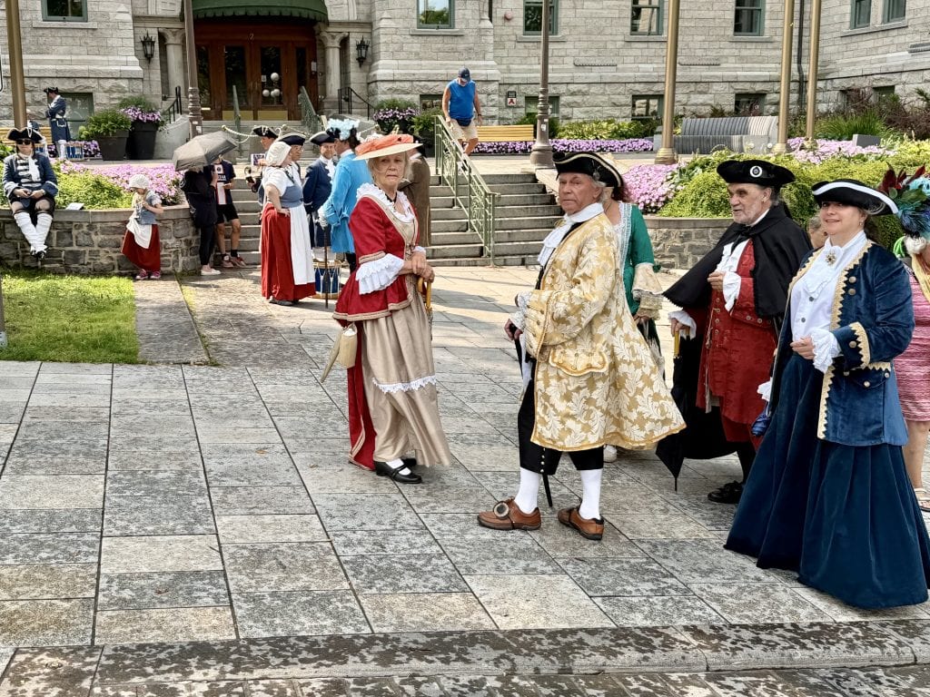 Lots of locals in 1700s period costume