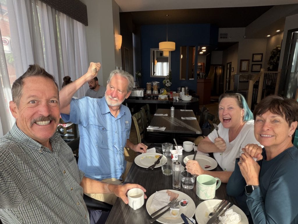 At breakfast with Gregg about to stab me with a fork